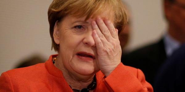 German Chancellor Merkel gestures at a CDU/CSU parliamentary group meeting at the Bundestag in Berlin