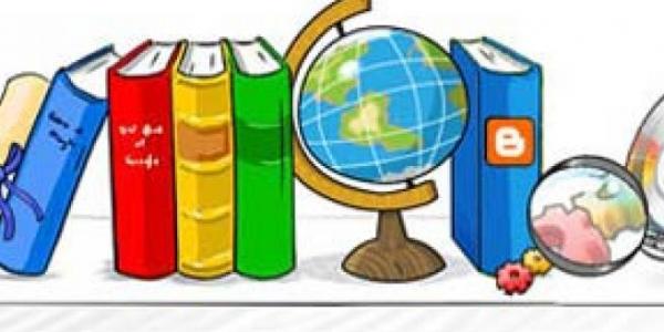 Alfabetización: libros en un estante junto a una bola del mundo 